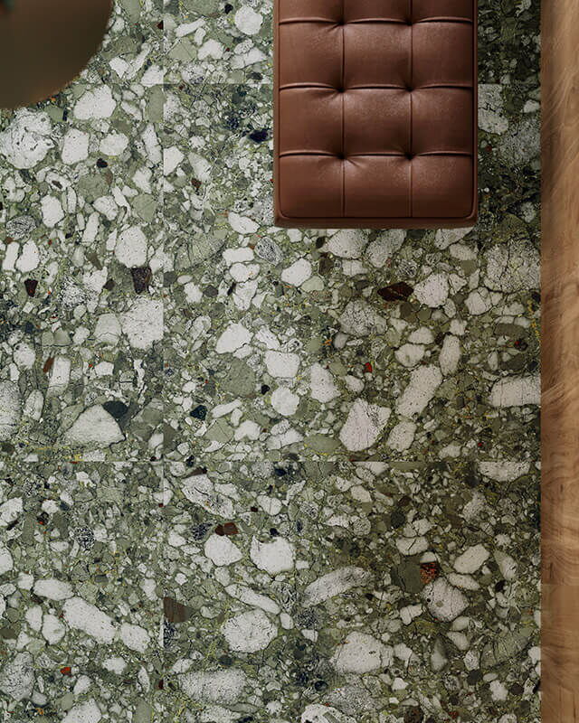 Grün-weiß-schwarz gesprenkelten Fliese in Terrazzo-Optik von oben