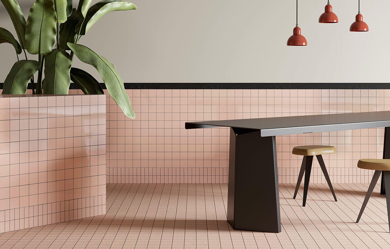 rosa quadratische Designerfliesen DIN in einem modernen Essbereich mit schwarzem Tisch und Hockern